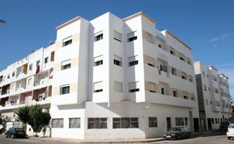 عمارة كائنة بالمحمدية موضوع معاوضة عينية مشروطة مع قطعة أرضية "بوكة بن سعيد" كائنة بالمحمدية